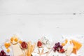 Various types of cheese with fruits on the wooden white table with copy space. Top view Royalty Free Stock Photo