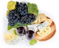Various types cheese, glasses of red wine, fresh blue grapes Royalty Free Stock Photo