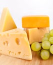 Various types of cheese with grapes