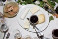 Various types of cheese plate served with jam in dinner party