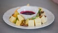 Various types of cheese with sauce, Pieces of cheese and sauce on a plate Royalty Free Stock Photo