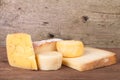 Various types of cheese on a wooden background Royalty Free Stock Photo