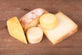 Various types of cheese on a wooden background Royalty Free Stock Photo