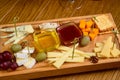 Various types of cheese on wooden cutting board Royalty Free Stock Photo