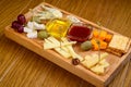 Various types of cheese on wooden cutting board Royalty Free Stock Photo