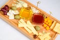 Various types of cheese on wooden cutting board Royalty Free Stock Photo