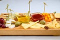 Various types of cheese on wooden cutting board Royalty Free Stock Photo