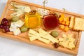 Various types of cheese on wooden cutting board Royalty Free Stock Photo