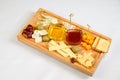 Various types of cheese on wooden cutting board Royalty Free Stock Photo