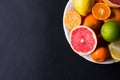 Various types of citrus fruit on a dark background Royalty Free Stock Photo