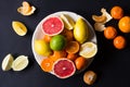 Various types of citrus fruit on a dark background Royalty Free Stock Photo
