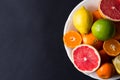 Various types of citrus fruit on a dark background Royalty Free Stock Photo