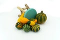 Various types of decorative pumpkins are decorative around a cha