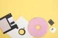 various types of disks for storing information on a yellow background, modern and retro disks and floppy disks Royalty Free Stock Photo