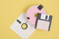various types of disks for storing information on a yellow background, modern and retro disks and floppy disks Royalty Free Stock Photo