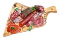 Various types of Dried organic salami sausage on wooden cutting board Royalty Free Stock Photo