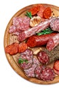 Various types of Dried organic salami sausage on wooden cutting board Royalty Free Stock Photo