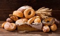 Various types of fresh baked bread with wheat ears Royalty Free Stock Photo