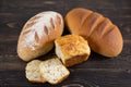 Various types of fresh bread on a wooden background Royalty Free Stock Photo
