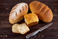 Various types of fresh bread on a wooden background Royalty Free Stock Photo