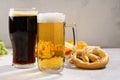Various types of beer - light and dark and snack variety Royalty Free Stock Photo