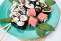 Various types of maki sushi, philadelphia, maki, salmon, rice, salad. Delicious and healthy food. Close-up Royalty Free Stock Photo