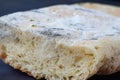 A variety of mold fungi on a loaf of bread. Mold growing on a loaf of bread indicates rotting and spoiled food in the Royalty Free Stock Photo