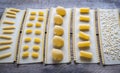 Various types of pasta on lasagne sheets Royalty Free Stock Photo