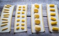 Various types of pasta on lasagne sheets Royalty Free Stock Photo