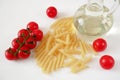 Various types of pasta, Raw pasta set and tomato on white background, set Royalty Free Stock Photo