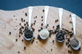 Various types of pepper on a wooden background Royalty Free Stock Photo