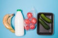 Various types of plastic packaging on a blue background, Royalty Free Stock Photo