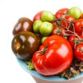 Various types of tomatoes in a bowl on the table Royalty Free Stock Photo