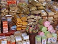 various types of traditional snacks wrapped in plastic are being placed