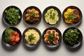 various types of vegetables sitting in small black bowls. Healthy snack foods with small bowls. Small breakfast bowls