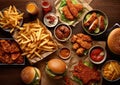 Various unhealthy fast food with sauces on wooden table.Top view.AI Generative