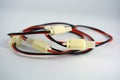 Large electric red black wires on 12V, 220V with white plastic dad connector and mom located on a white plastic background.