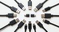 Various USB cables are arranged in a circular formation on a white background. Royalty Free Stock Photo