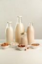 Various vegan plant based milk and ingredients. Dairy free milk substitute drinks in glass bottles