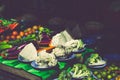 Various vegetables display on wooden table for sale at fresh market stall with faded color effect