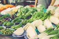 Various vegetables display on wooden table for sale at fresh market stall
