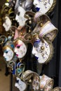 Various Venetian Masks Hanging Outside a Shop