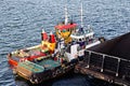 Various views of vessels and tugboats in port. Close-up view of the ships and barges construction. Port of Muara Pantai, Indonesia