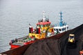 Various views of vessels and tugboats in port. Close-up view of the ships and barges construction. Port of Muara Pantai, Indonesia