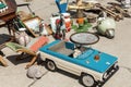 Various vintage old staff ,collectibles and toys at weekend open air swap meet marketplace at bright sunny day. Retro