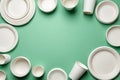 Eco-Friendly Disposable Tableware Frame on Green Background Royalty Free Stock Photo