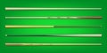 Various wooden billiard cues on green background. Snooker sports equipment. Vintage pool cue. Active recreation and