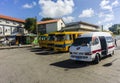 Various yellow buses standing parked at Constitution River Terminal in Barbadian capital city Bridgetown