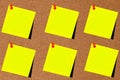 Various yellow post it with red thumbtack and blackboard background