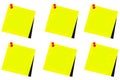 Various yellow post it with red thumbtack and white background